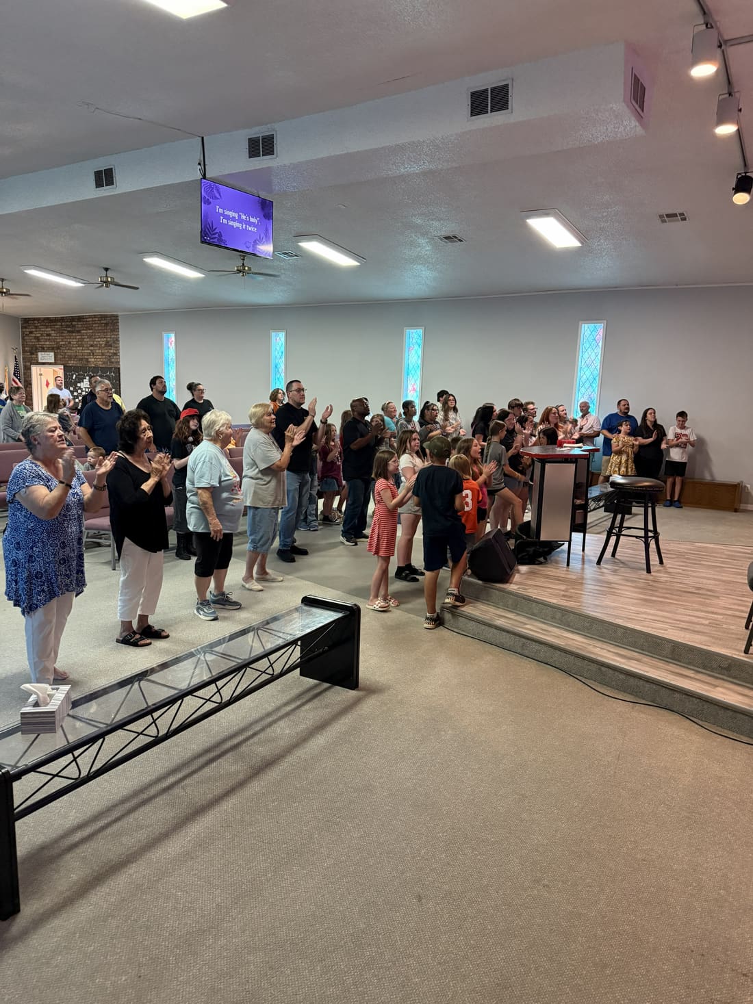 Sunday worship congregation clapping